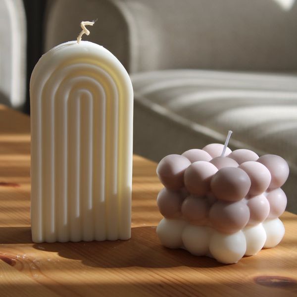 Person meditating in a serene natural environment with soft lighting.